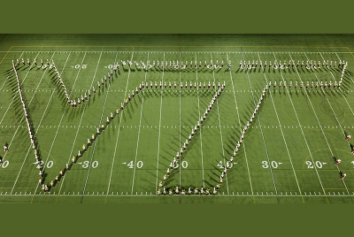 An overhead image of The Marching Virginians on the football field forming the letters VT