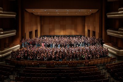 All the participants of the VT Honor Band stand in the oss Arts Center for a group photo.