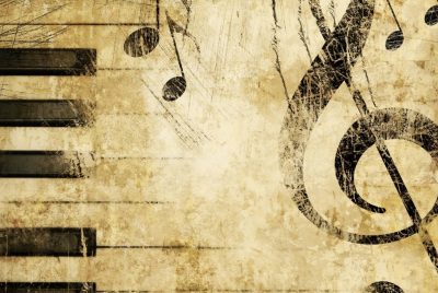 image of piano keys, a treble clef, and music notes 