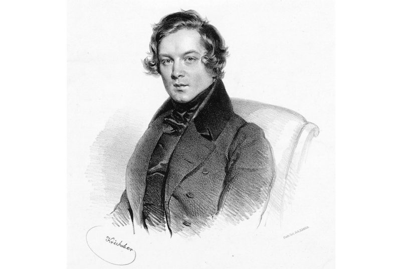 A black and white drawing  of composer Robert Schumann,  wearing a collared jacket and sitting in a chair
