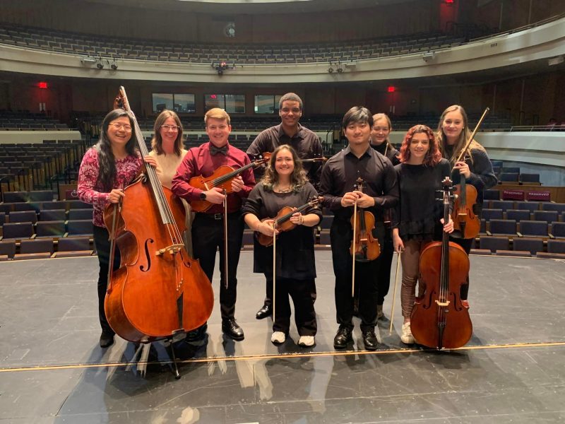 The Virginia Tech String Project staff pictured together on stage.